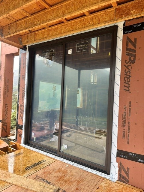 Weather Shield Mountain Modern Residence - sliding door installation in progress