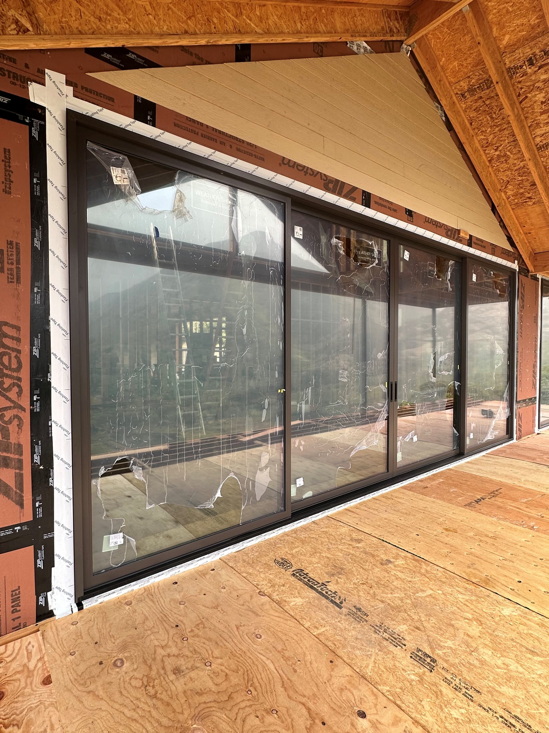 Weather Shield Mountain Modern Residence - sliding door wall exterior view