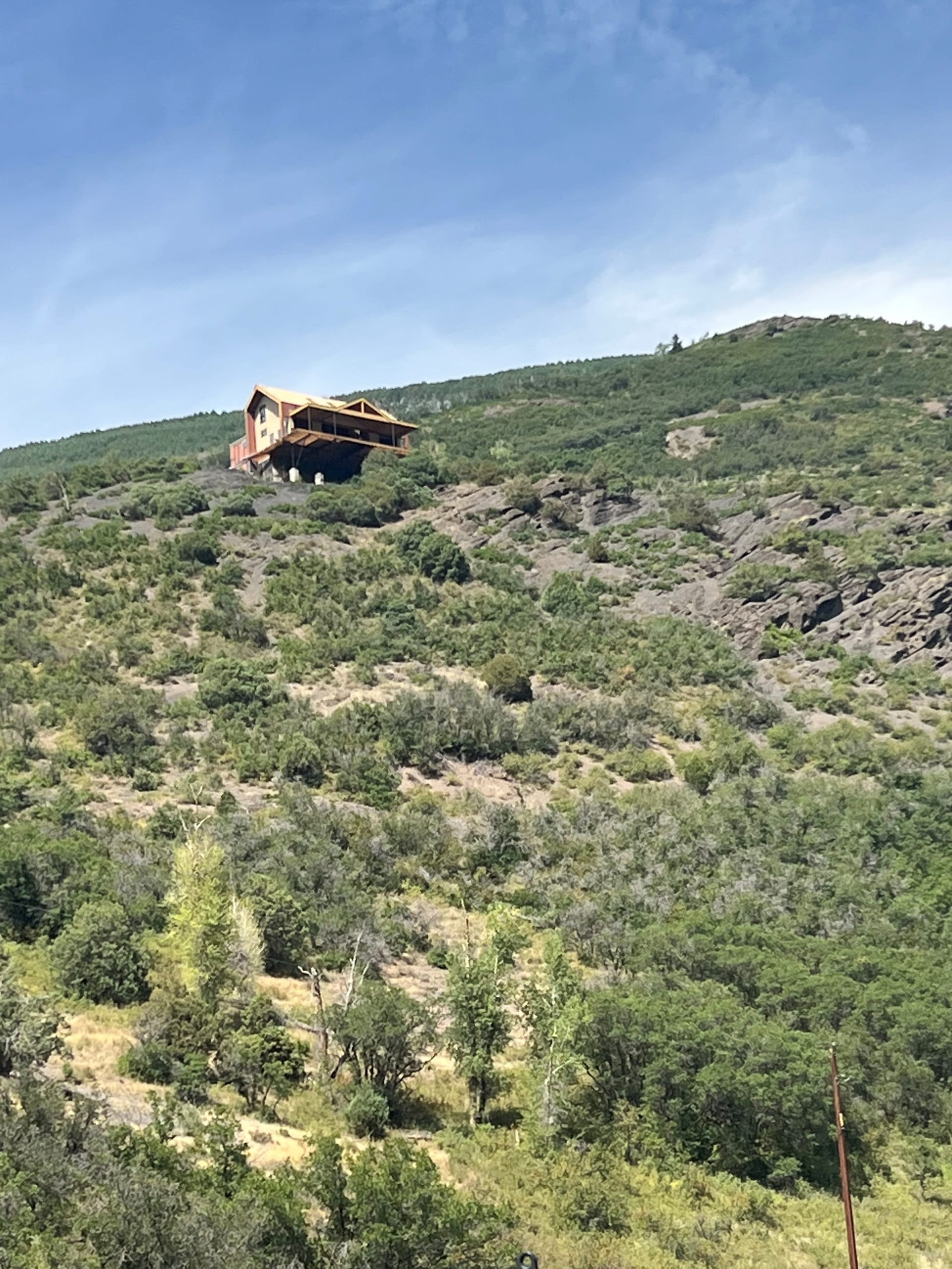 Weather Shield Mountain Modern Residence - home viewed from the road below